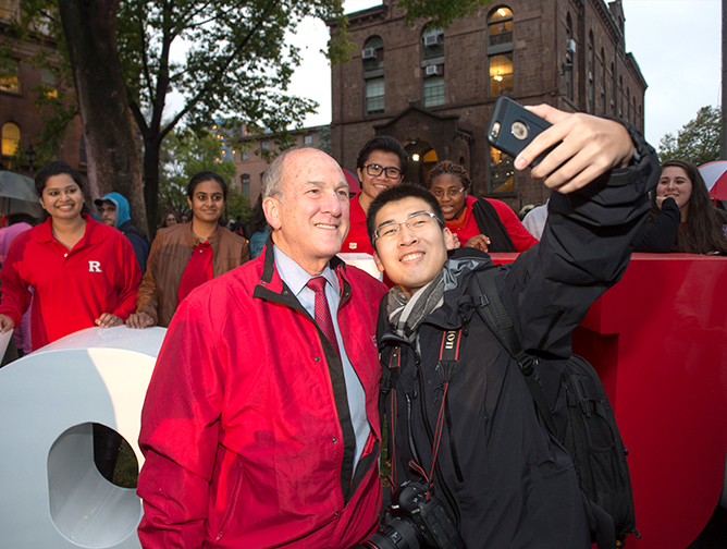 President Barchi takes a selfie with a student